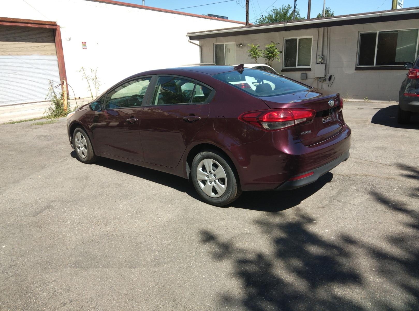 2017 Maroon /Black Kia Forte LX 6A (3KPFL4A78HE) with an 2.0L L4 DOHC 16V engine, 6A transmission, located at 3605 W Overland Rd., Boise, ID, 83705, (208) 863-0063, 43.589729, -116.226181 - This Kia Forte sedan is in excellent condition with 60,100 miles on it. It is maroon with black cloth interior. If you would like to come and test drive it, call us at 208 863-0063 to set up a time to drive it. Or stop by to see it. You will like it. - Photo #2